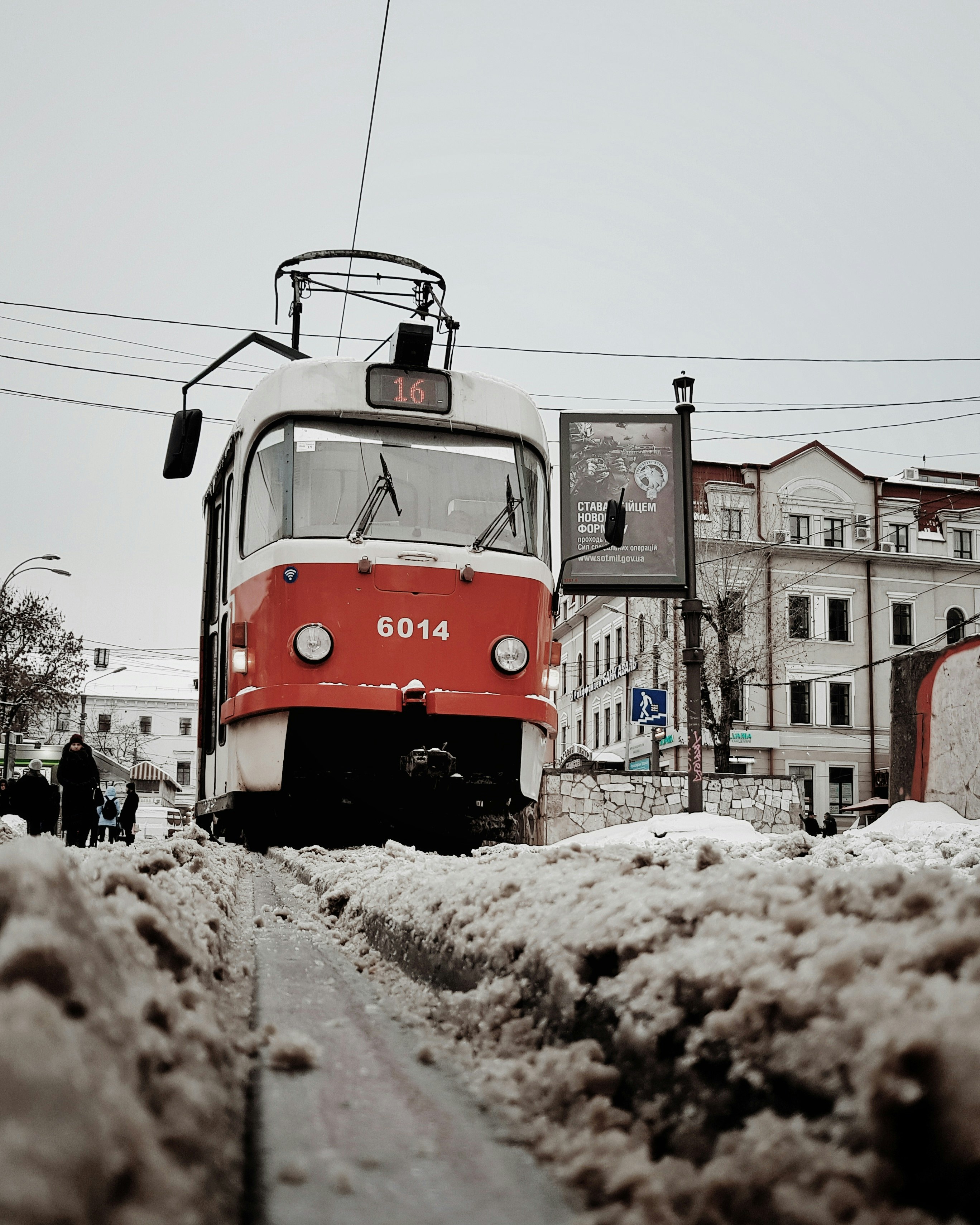 red and gray electric vehicle during daytime